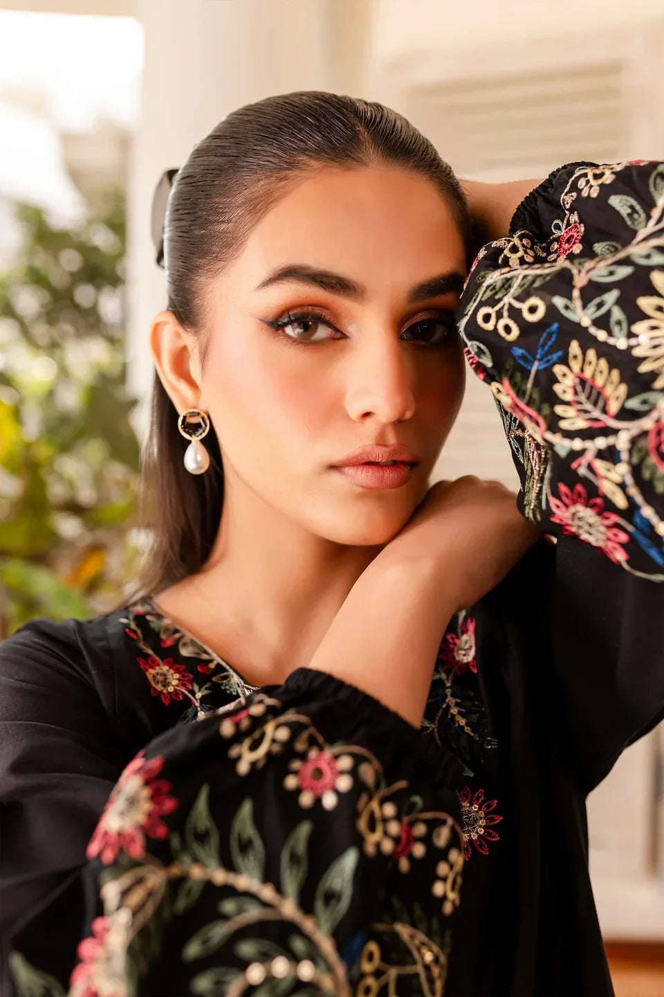 Floral embroidery detail on sleeve of black Heer Prêt suit