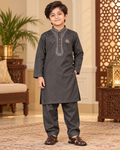 Boy wearing a charcoal grey embroidered kameez and matching salwar