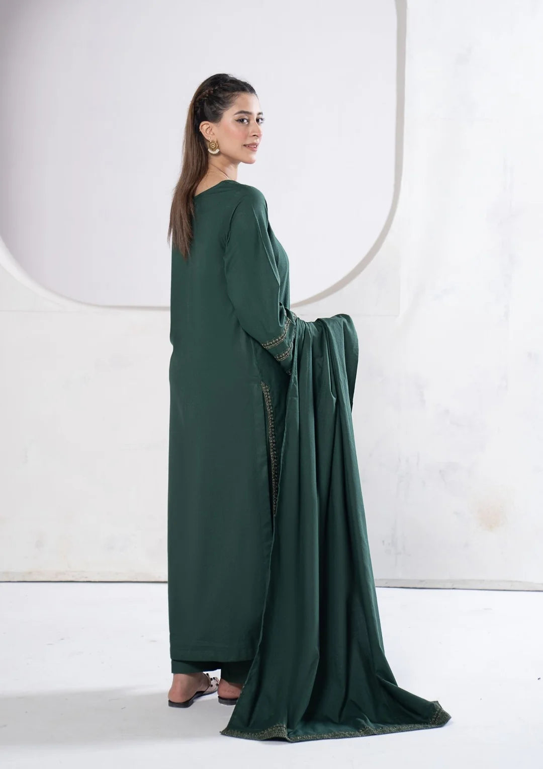 Elongated embroidered neckline on deep green shirt