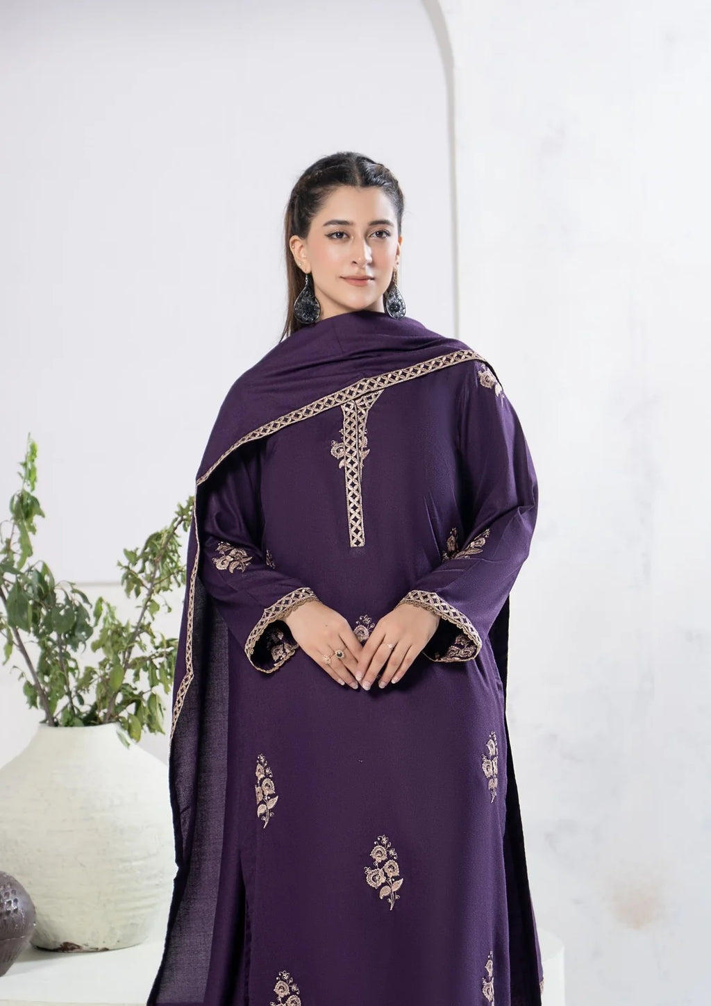 Plum winter suit styled with contrasting bordered shawl
