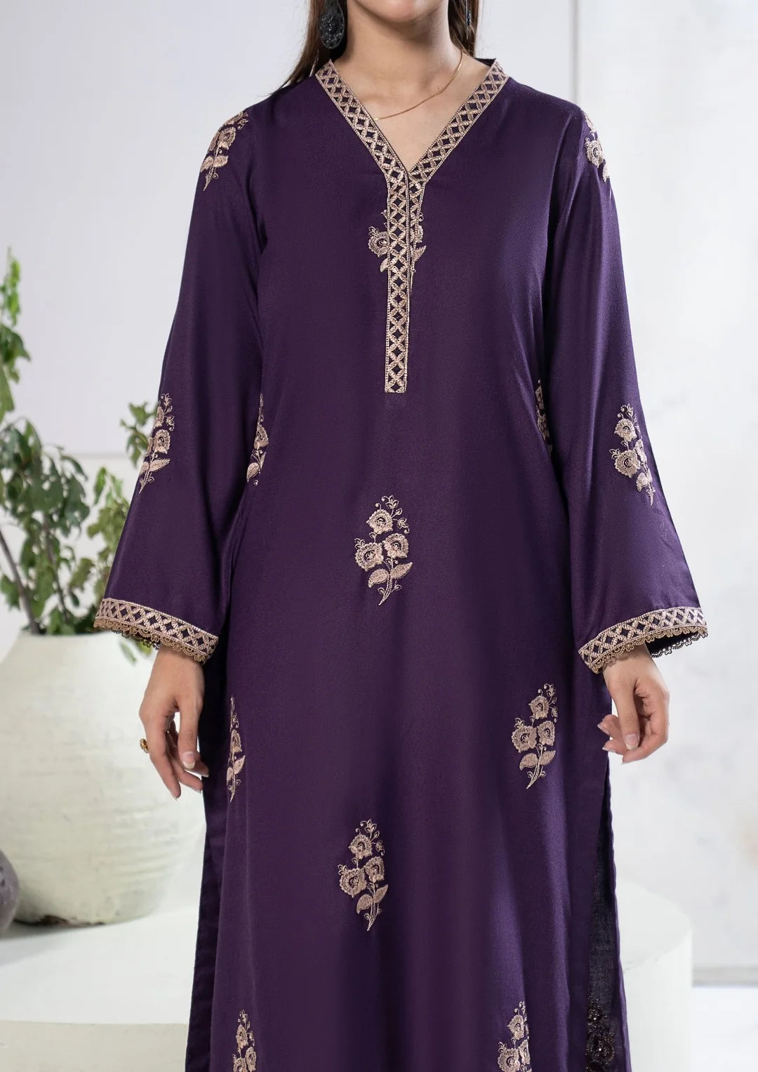 Back view of plum outfit with coordinated bordered shawl