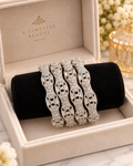 Silver 4-piece bangle set with real stones in a jewellery box