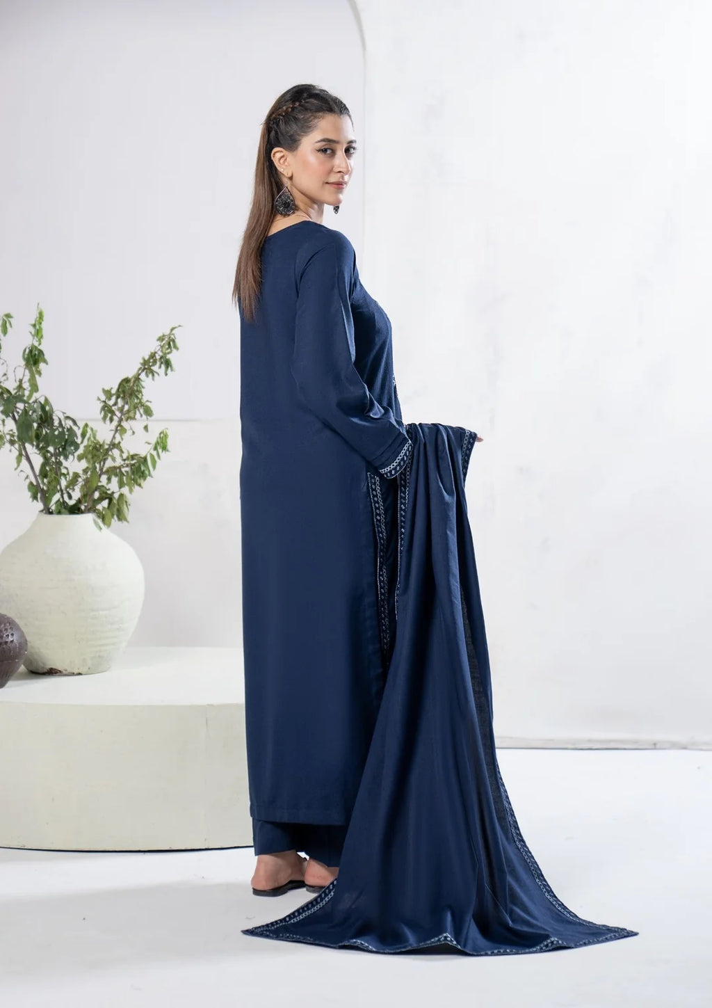 Back view of navy blue three-piece winter suit