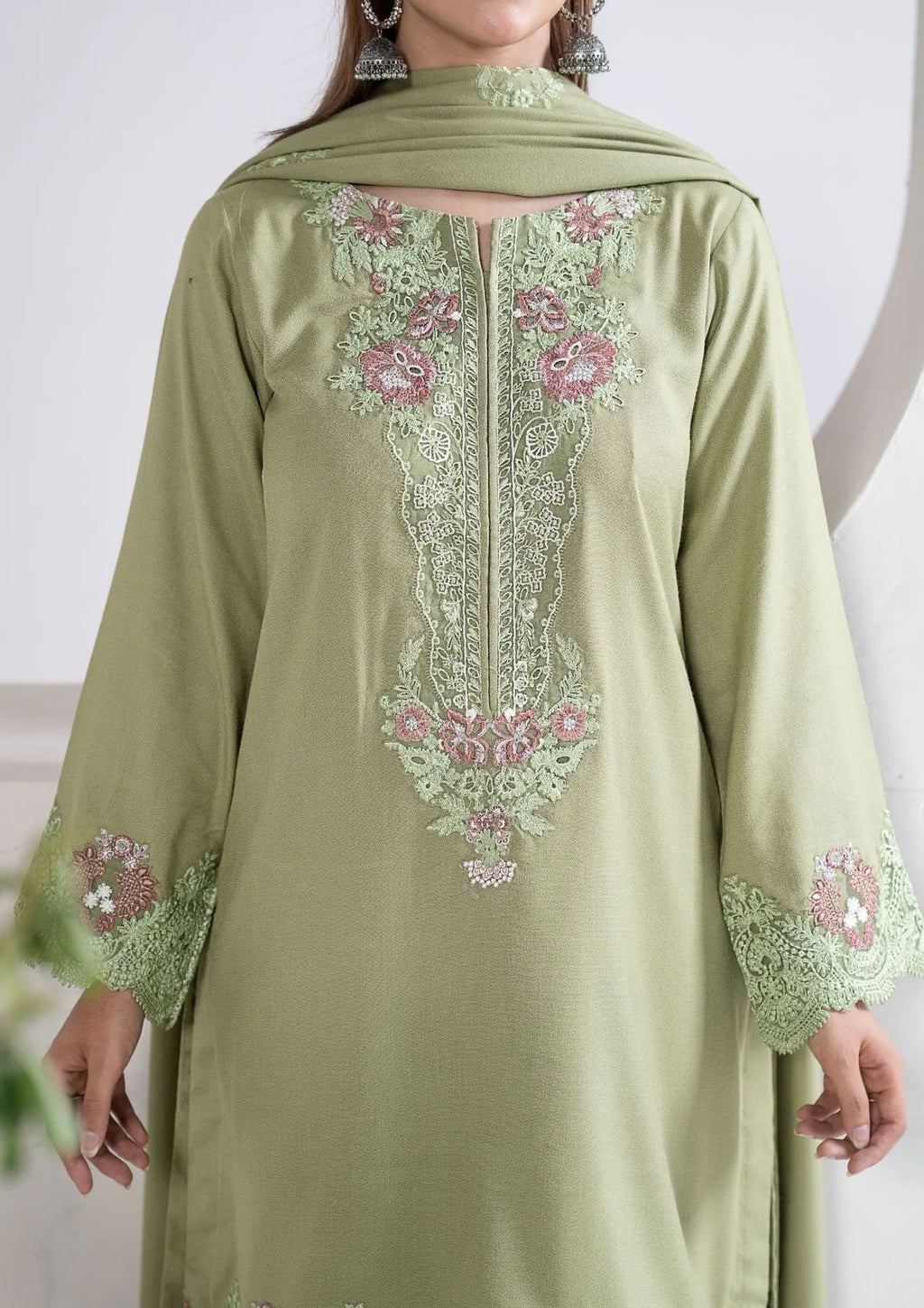 Green three-piece winter outfit with scalloped embroidered shirt border