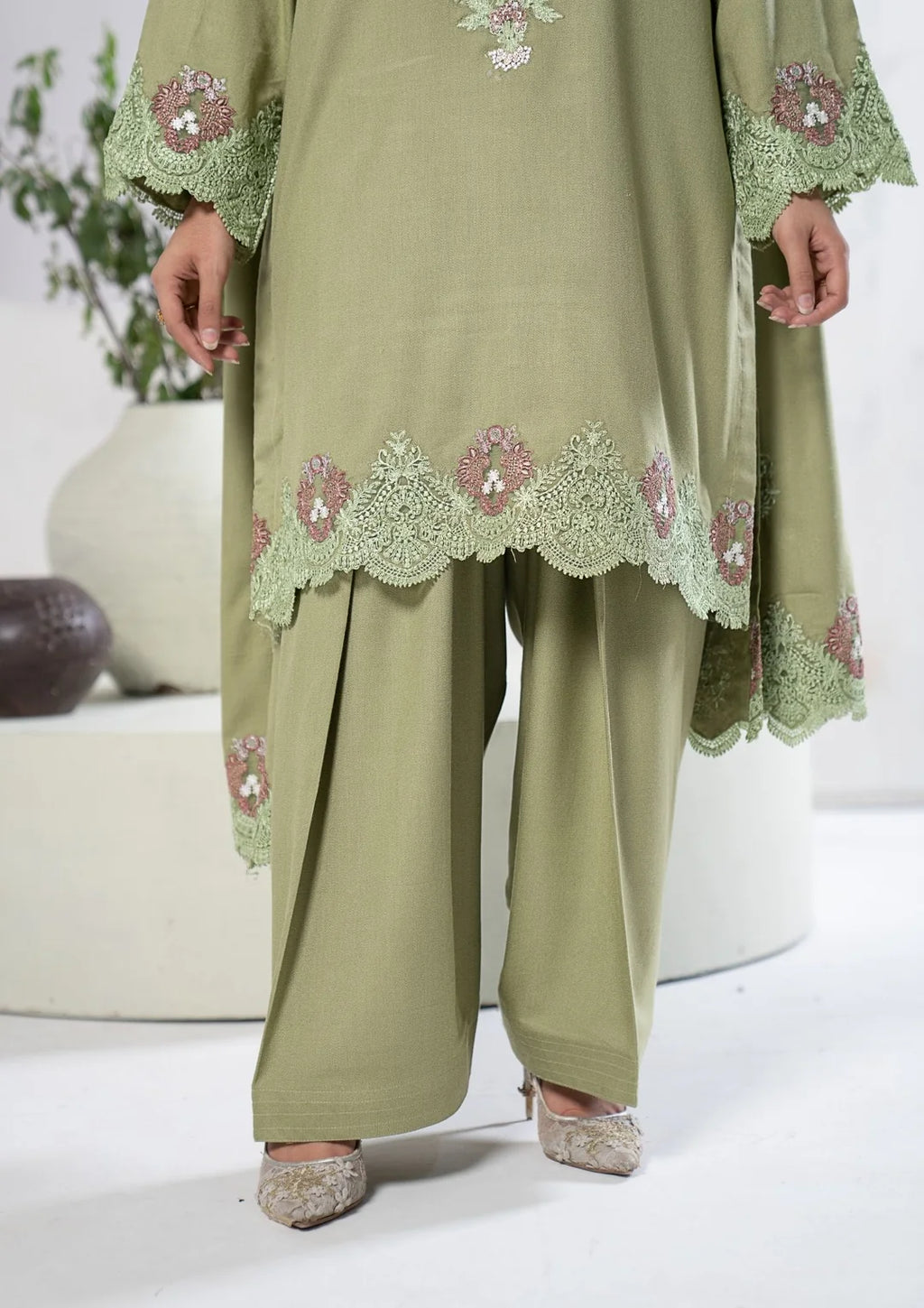 Scalloped embroidered green shirt hem and matching shalwar