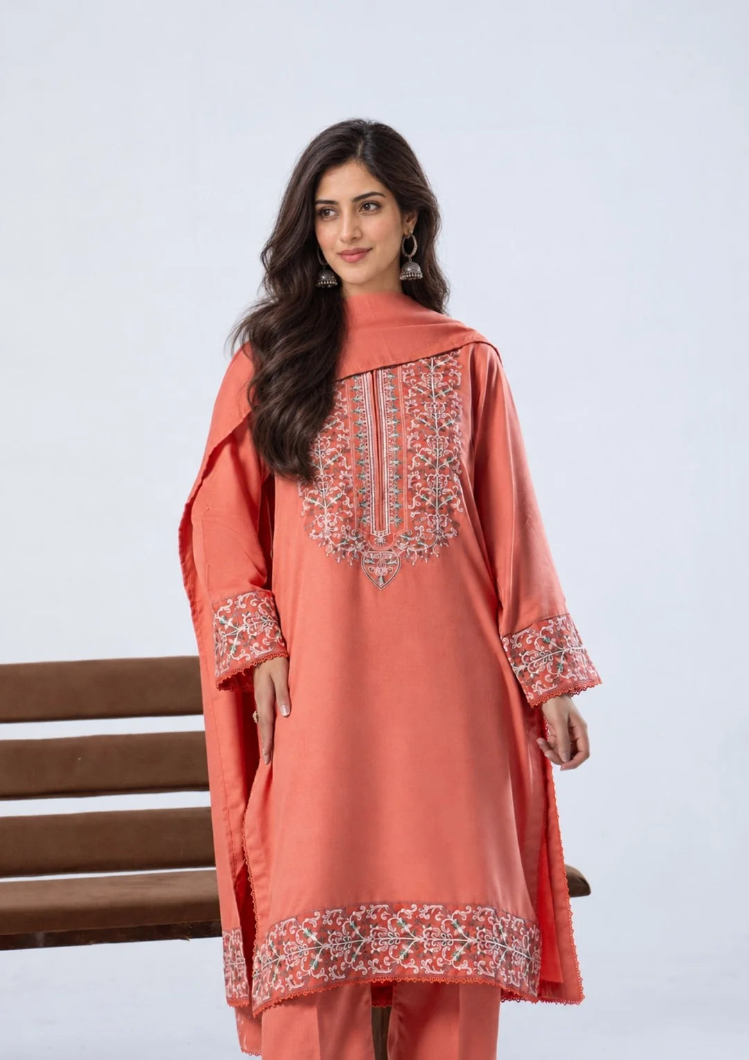 Coral shirt with embroidered neckline cuffs and hem