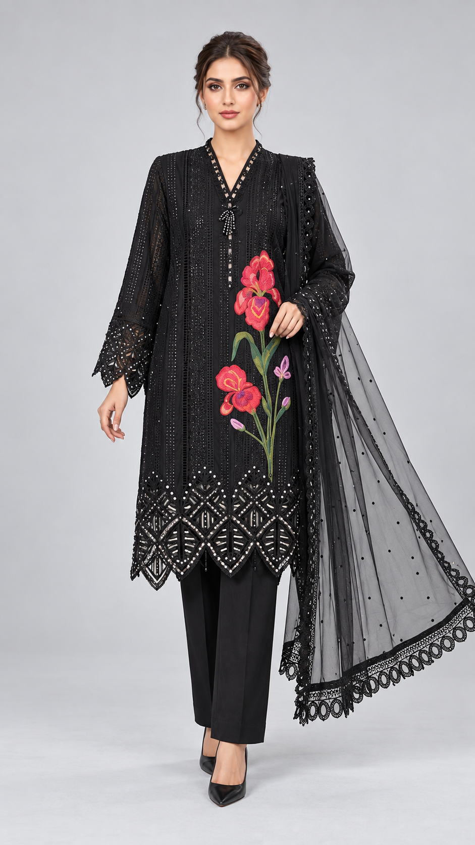 Black embroidered three-piece suit with pink floral motif and net dupatta