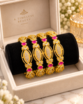 Hot pink and gold 4-piece bangle set in a jewellery box
