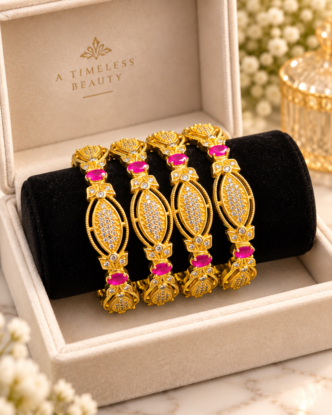 Hot pink and gold 4-piece bangle set in a jewellery box
