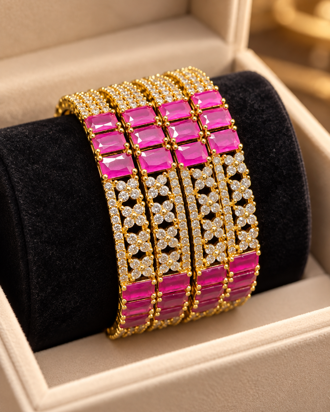 Gold and pink 4-piece bangle set in jewellery box