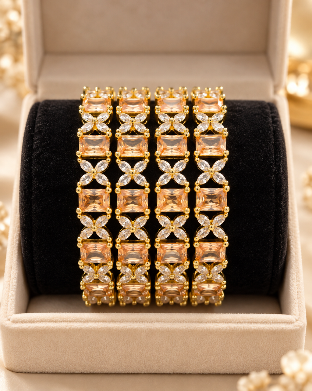 Gold champagne floral bangles close up