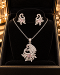 Silver and pink crystal pendant necklace and matching earrings in a jewellery box